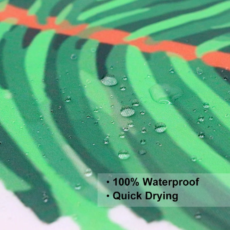 May include: Close-up of a green and orange tropical leaf patterned fabric shower curtain with water droplets on the surface. The text "100% Waterproof" and "Quick Drying" is visible at the bottom of the image.