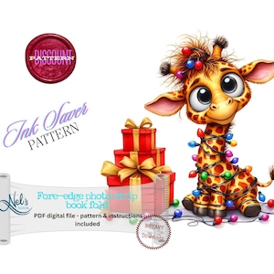 May include: A digital download pattern for a book fold featuring a cute cartoon giraffe with Christmas lights wrapped around its neck. The giraffe is standing in front of a stack of red and gold gift boxes. The pattern is called "Ink Saver Pattern" and is available for instant download.