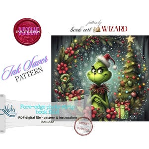 May include: A digital pattern for a book fold project featuring a green creature in a Santa hat standing before a decorated Christmas tree and wreath. Text includes "Discount Pattern," "Ink Saver Pattern," "Nel's Nook," and "Fore-edge photo strip book fold."