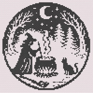 May include: Black and white cross-stitch design in a circular frame. The image depicts a witch stirring a cauldron over a fire, with a dog, trees, a crescent moon, and stars. The design has a folk art style.