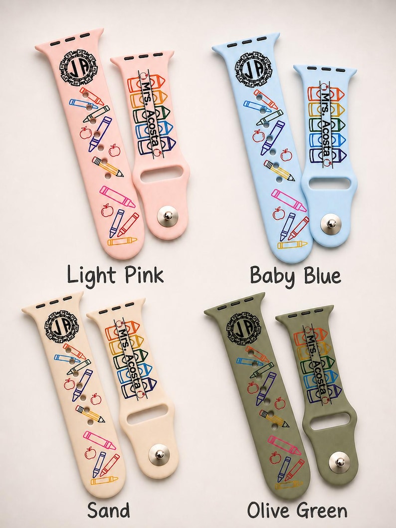 May include: Four sets of silicone watch straps in light pink, baby blue, sand, and olive green. Each set features a circular monogram with the letters JP and a vertical row of colourful crayons with the text Mrs. Acosta, plus small apple icons.