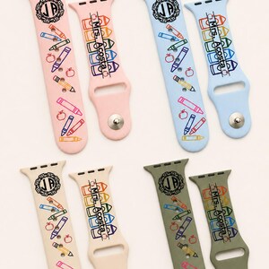May include: Four pairs of silicone watch bands in light pink, light blue, beige, and olive green. Each band features a circular monogram with the letters JP, a stack of colourful crayon illustrations, apple icons, and the text Mrs. Acosta.