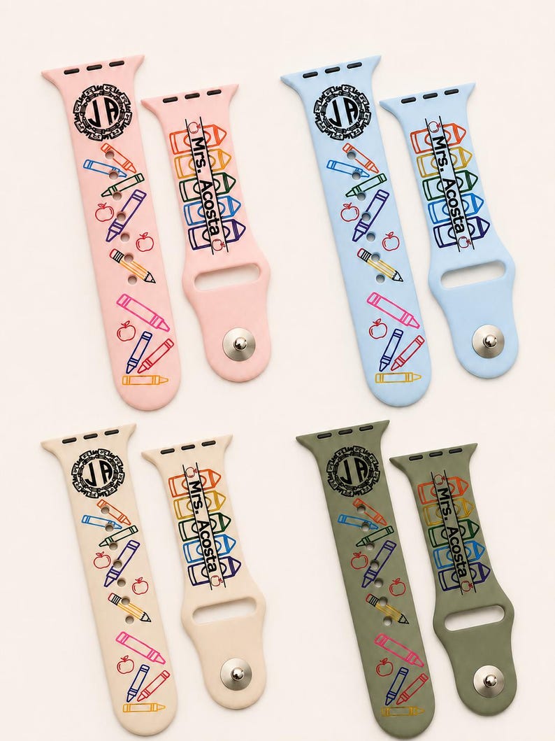 May include: Four pairs of silicone watch bands in light pink, light blue, beige, and olive green. Each band features a circular monogram with the letters JP, a stack of colourful crayon illustrations, apple icons, and the text Mrs. Acosta.