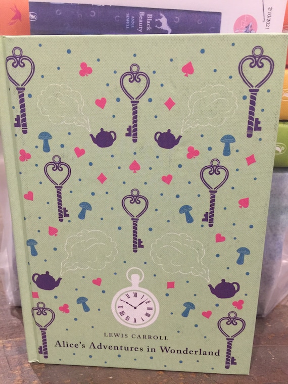 PUFFIN CLASSICS Nuevo: Las aventuras de Alicia en el país de las