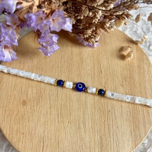 Protective eye bracelet with mother-of-pearl heishi beads