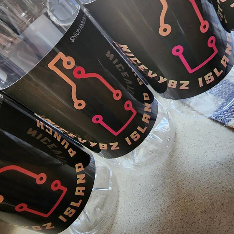 May include: Several clear plastic bottles with black labels. The labels feature a circuit board design in shades of orange and pink, along with the text "NICEVYBZ ISLAND" and "PUNCH". The bottles are partially filled.