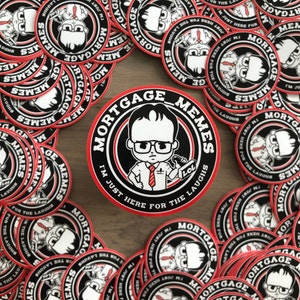 May include: A close-up of a sticker with a red border and black and white design. The sticker features a cartoon character with glasses and a red tie. The text on the sticker reads "Mortgage_Memes I'm Just Here For The Laughs LOL".