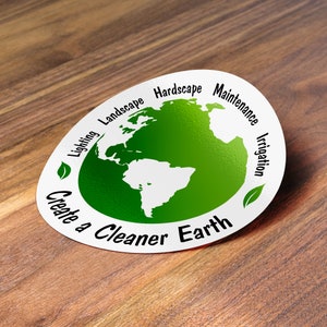 May include: A white sticker with a green globe in the centre and the text "Create a Cleaner Earth" around the globe. The globe is surrounded by the words "Lighting", "Landscape", "Hardscape", "Maintenance", and "Irrigation".