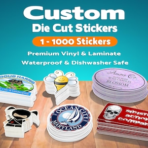 May include: Custom die cut stickers with text reading Custom Die Cut Stickers, 1-1000 Stickers, Premium Vinyl & Laminate, Waterproof & Dishwasher Safe. Stacks of stickers feature designs including a landscape, a bee, a candle label, a ninja, a sailboat, and a skull.