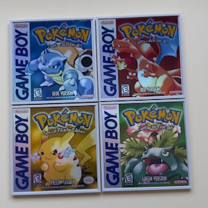 May include: Four vintage Nintendo Game Boy Pokémon game cartridges. The titles include Blue Version, Red Version, Yellow Legacy, and Green Version. Each cartridge features the Pokémon logo and the phrase "Gotta catch 'em all!"