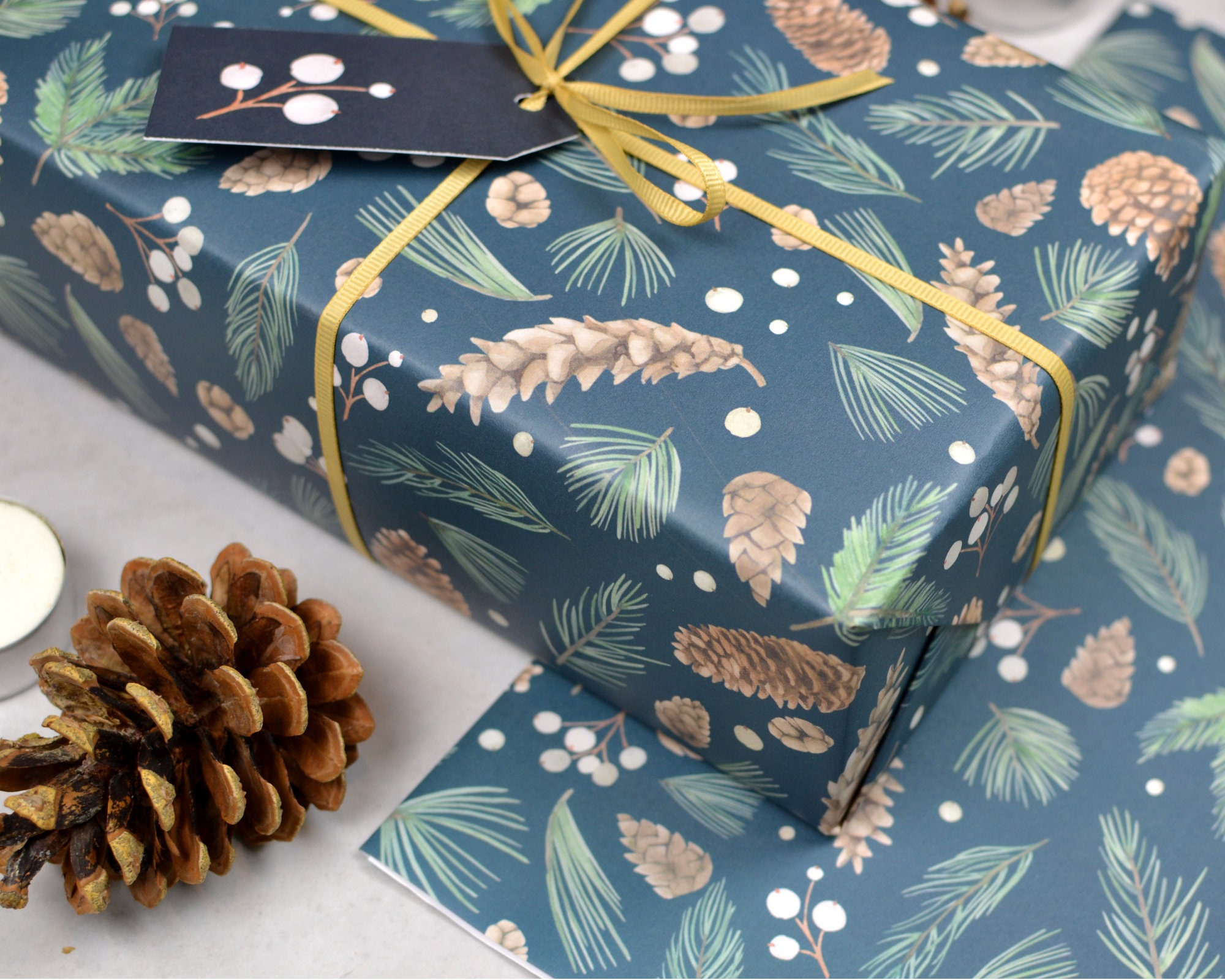 Premium Photo  Christmas organic wrapping gifts with cone pines and  brunches on wooden background