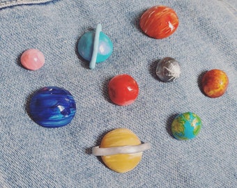 yugenhandmadeco Solar System Planet Enamel Pin Set of 9 - Illustrated Lapel Pins by Lauren Beacham, PLANETARY Pins for Stocking Stuffers, Science Gifts