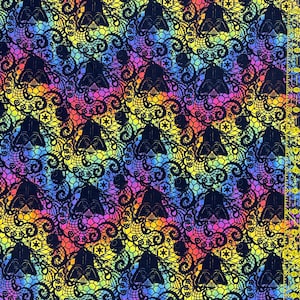 May include: A patterned fabric featuring black Darth Vader helmets and floral lace against a rainbow gradient. A clear ruler with yellow markings is on the right. Ideal for crafting and sewing. The fabric's design is eye-catching and suitable for various projects.