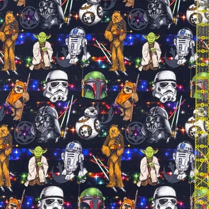 May include: Dark blue fabric patterned with Star Wars characters including Darth Vader, Yoda, Chewbacca, and R2-D2. The design also features helmets, lightsabers, and a starry background.