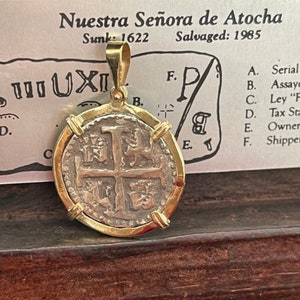 Atocha shipwreck treasure Mel fisher silver coin pendant in 14k gold bezel made from atocha silver