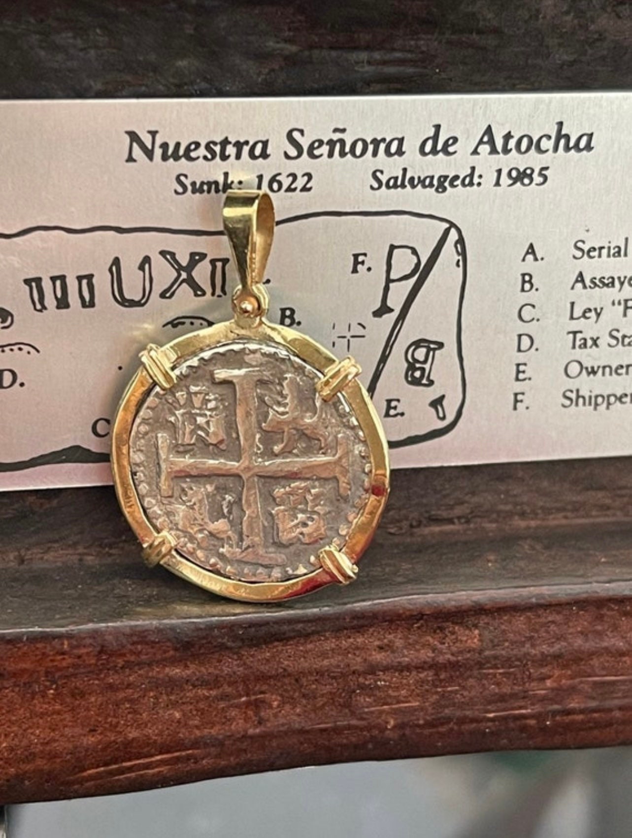Atocha shipwreck treasure Mel fisher silver coin pendant in 14k gold bezel made from atocha silver