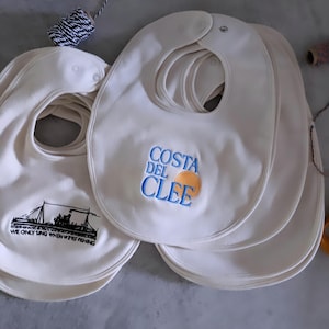 Embroidered Baby Bib - Costa Del Clee or We Only Sing