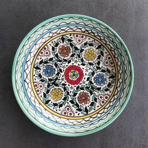 Turquoise fruit bowl with oriental floral details, salad bowl, eating utensils, table decoration, boho