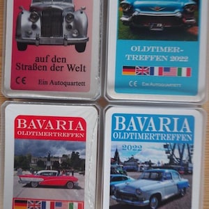 Op de afbeelding: Vier oldtimer ruilkaarten. De kaarten tonen klassieke auto's met Duitse tekst. De kaarten bevatten de tekst "OLDTIMER FUNDSTÜCKE", "TEGERNSEE" en "BAVARIA OLDTIMERTREFFEN 2022".