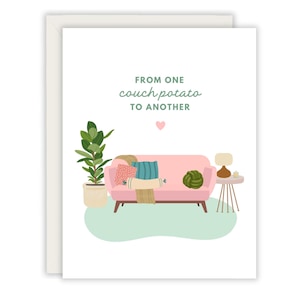 May include: Greeting card with a white border featuring a pink sofa with pillows and a blanket, a potted plant, and a side table with a lamp. The text "FROM ONE couch potato TO ANOTHER" is written above the sofa.