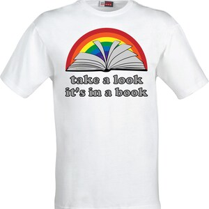 May include: White t-shirt with a rainbow arc over an open book and the text "take a look it's in a book".