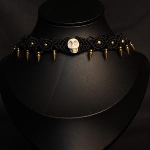 Golden beads and spikes on black thread choker