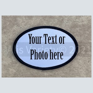 May include: White oval patch with black stitching around the edge. The patch has black text that says "Your Text or Photo here".
