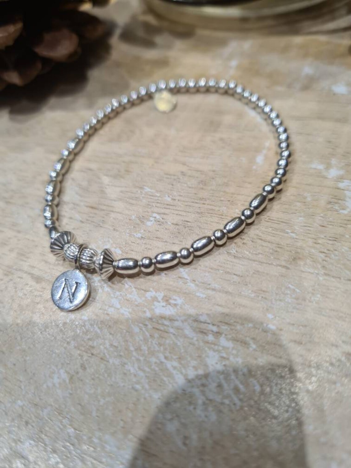 Sterling silver mini initial charm on 3mm bracelet | Etsy