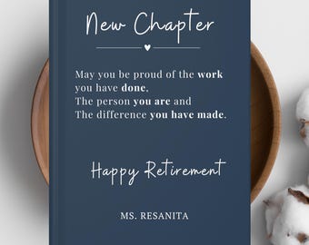May include: A navy blue notebook with the words "New Chapter" in white script. The text below reads "May you be proud of the work you have done...Happy Retirement, MS. RESANITA."