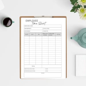 May include: A clipboard with an "EMPLOYEE Time Sheet" form. The form includes fields for employee name, department, date, and time tracking. A cup of coffee and a teapot are in the background.