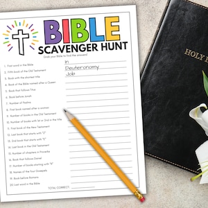 May include: A Bible Scavenger Hunt worksheet with a cross and colorful text. The worksheet is next to a closed Holy Bible and a pencil. The answers "Deuteronomy" and "Job" are written on the worksheet.