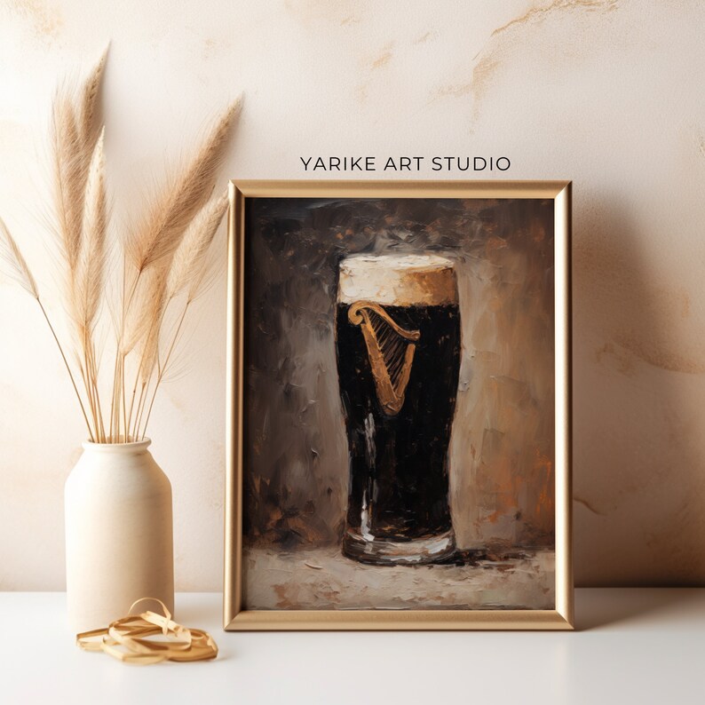 May include: A framed painting of a glass of Guinness beer with a white head. The painting is done in a realistic style with a brown background.