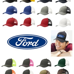 May include: A variety of colors of trucker hats with a mesh back. The hats are arranged in rows of three. The bottom row features a black hat with a white mesh back and a blue Ford logo.