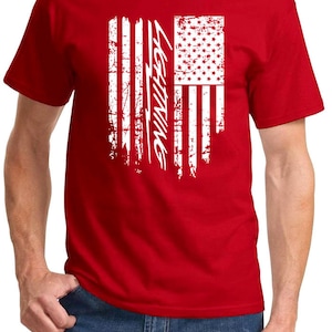 May include: Red t-shirt with a white distressed American flag design and the word "Lightning" printed on the flag.