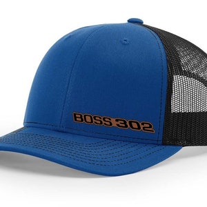 May include: A blue and black trucker hat with a brown embroidered "BOSS 302" logo.