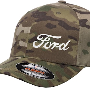 May include: A camouflage baseball cap with a white embroidered Ford logo. The cap has a Flexfit label on the back.