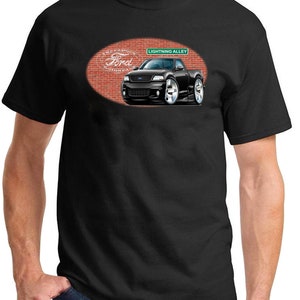 May include: Black t-shirt with a cartoon illustration of a black Ford Lightning pickup truck on a brick wall with the text "The Famous Ford Lightning" and "Lightning Alley".