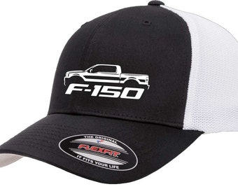 May include: Black and white trucker hat with a white silhouette of a Ford F-150 pickup truck and the text "F-150" in white. The hat has a black front and a white mesh back. The hat has a Flexfit label with the text "The Original Flexfit It Fits Your Life."