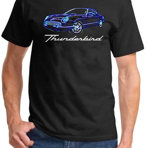 May include: A black t-shirt with a blue and white graphic of a Ford Thunderbird car and the text "Thunderbird".