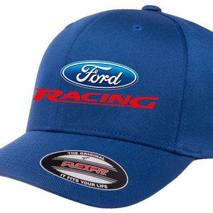 May include: A royal blue baseball cap with a white Ford logo and red "Racing" text. The cap has a Flexfit label on the underside of the brim.