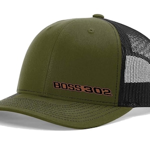 May include: A green and black trucker hat with a brown embroidered logo that says "BOSS 302".