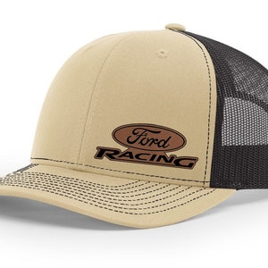 May include: A tan and black trucker hat with a brown leather patch that says "Ford Racing" in black lettering.