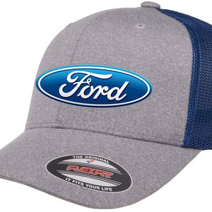 May include: A gray and blue baseball cap with a Ford logo on the front. The cap has a mesh back and a Flexfit label on the underside of the brim.