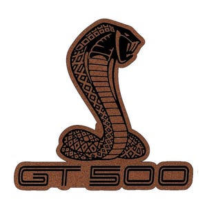 May include: A brown leather patch with a black outline of a cobra and the text "GT 500".