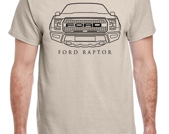 May include: A beige t-shirt with a black outline of a Ford Raptor truck and the text "FORD RAPTOR" printed on the front.