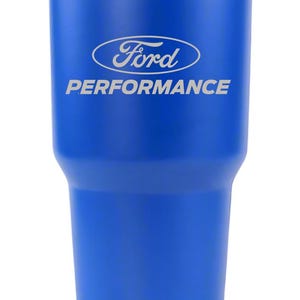 May include: A vibrant blue stainless steel tumbler featuring the silver Ford Performance logo engraved on the front. The drinkware has a tapered cylindrical shape with a metallic silver rim at the top and a matching silver base, set against a white background.