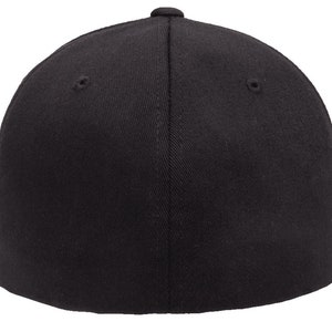 May include: A black fitted baseball cap with a flat brim. The cap is made of a soft, smooth fabric.