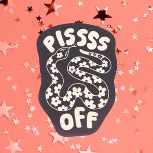 May include: A dark charcoal sticker featuring a white snake with a floral pattern on its body. The text PISSSS is arched above the snake and the word OFF is positioned below the snake in a bold, rounded white font against the dark background.