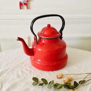 Vintage teapot kettle in red enamelled sheet metal