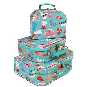 May include: Set of three turquoise suitcases with colourful cartoon stickers and text like "Cool Cat", "Chillin'" and "Top Banana".